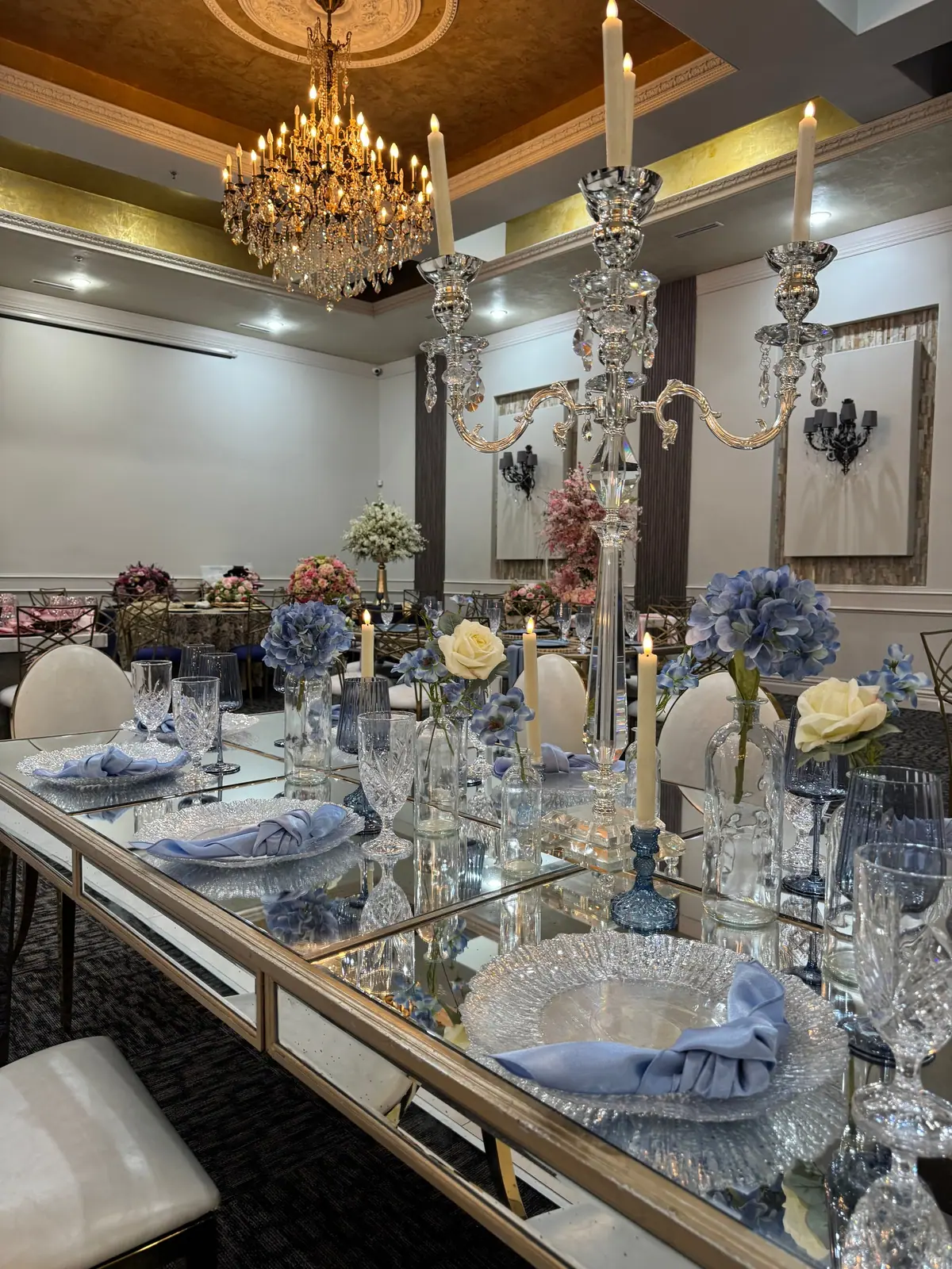 Crystal candelabra and blue-and-white china on a reception table